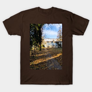 Sunlight between trees and a building in background T-Shirt